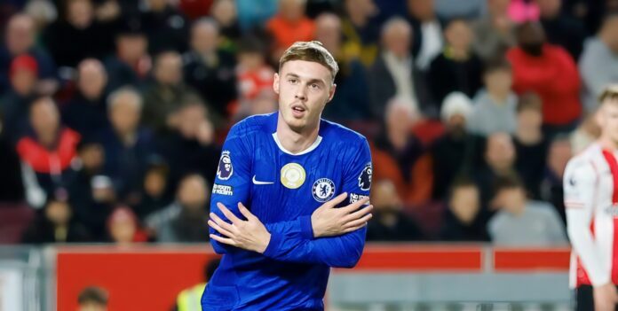 Soccer player celebrating in stadium.