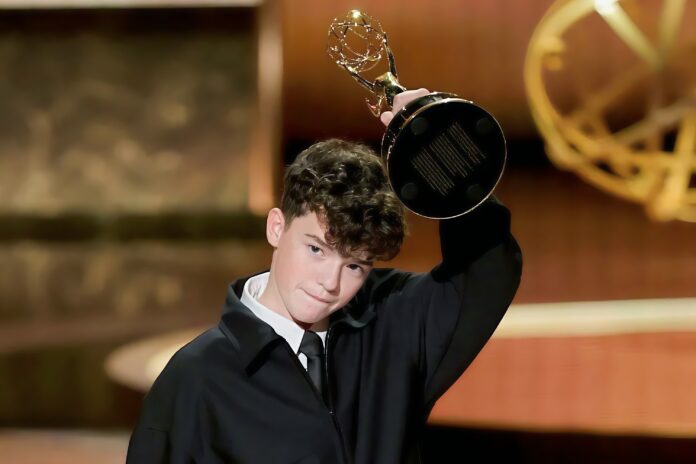 Award winner celebrating with trophy.